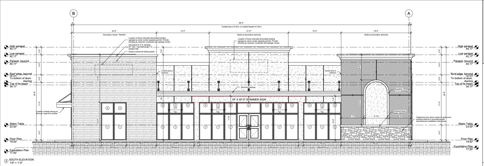 Storefront elevation drawing — aluminum storefront systems across a multi-bay façade, with marked openings, dimensions, and an aluminum awning.